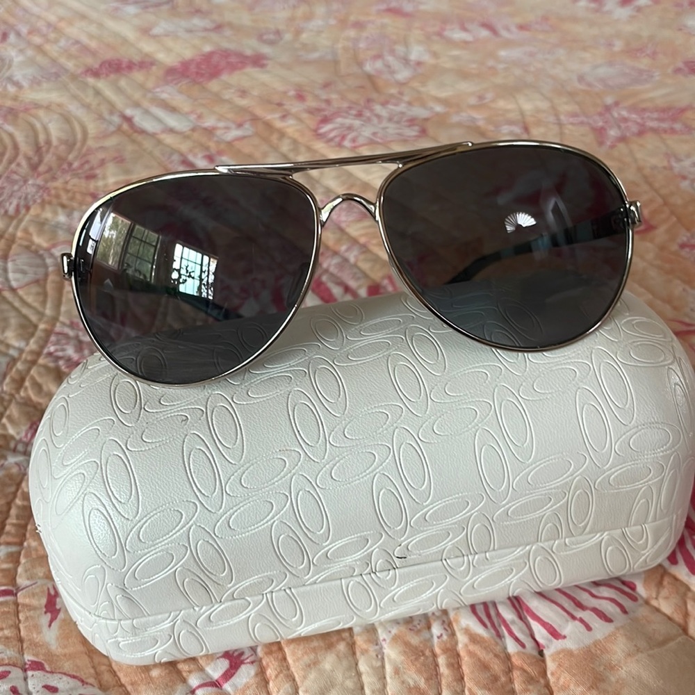 Women’s Oakley “Feedback” aviator sunglasses.